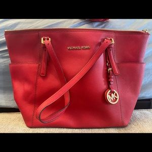 Red Michael Kors purse.
